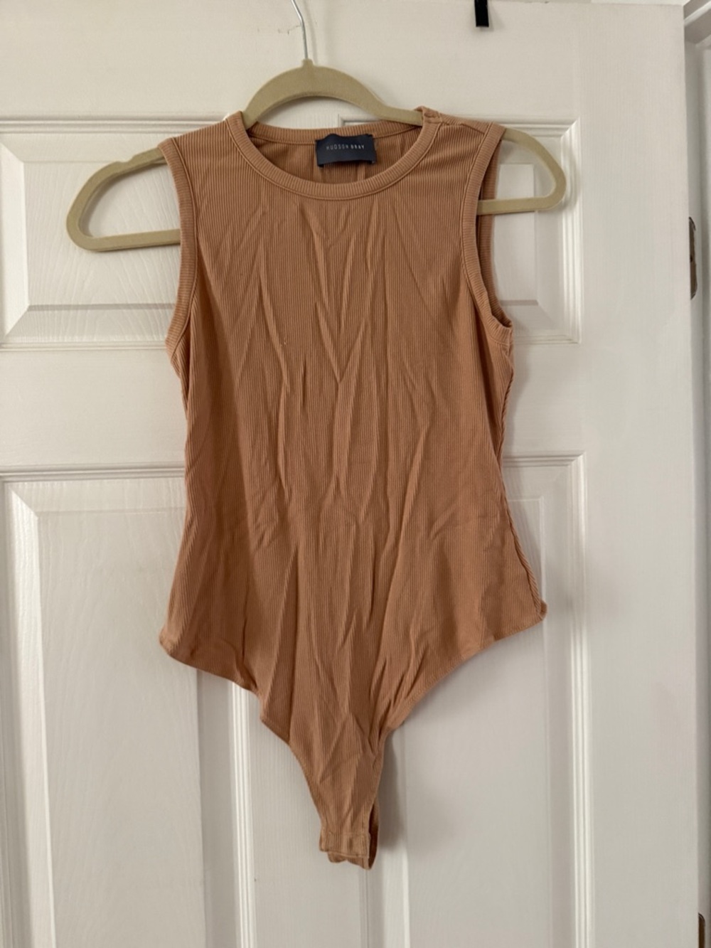 Sleeveless Ribbed Bodysuit in Camel Tan by Aritzia